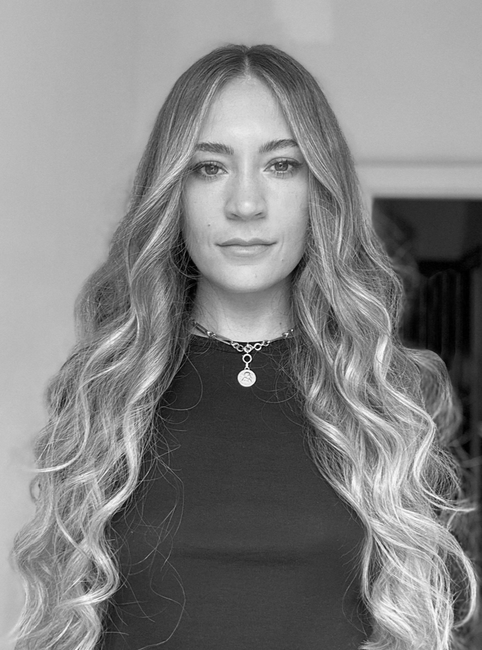 Black and white portrait of woman with long wavy hair
